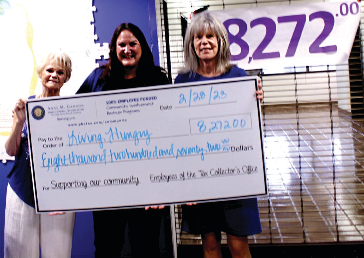 Marsha Grim - retired from tax collector’s office (left) and Constitutional Tax Collector Anne M. Gannon (right), presented a $8,272 check to Living Hungry representative Maura Plante (center).